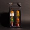 A gift pack containing two stacks of 3 bottles each of Rusty Barrel Flavoured Vodka, with different fruit labels on each bottle, arranged in a black box with a clear viewing window.