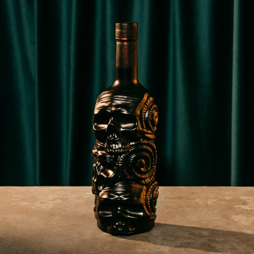 Decorative Rusty Barrel Caribbean Gold Rum bottle with skull design on a dark background