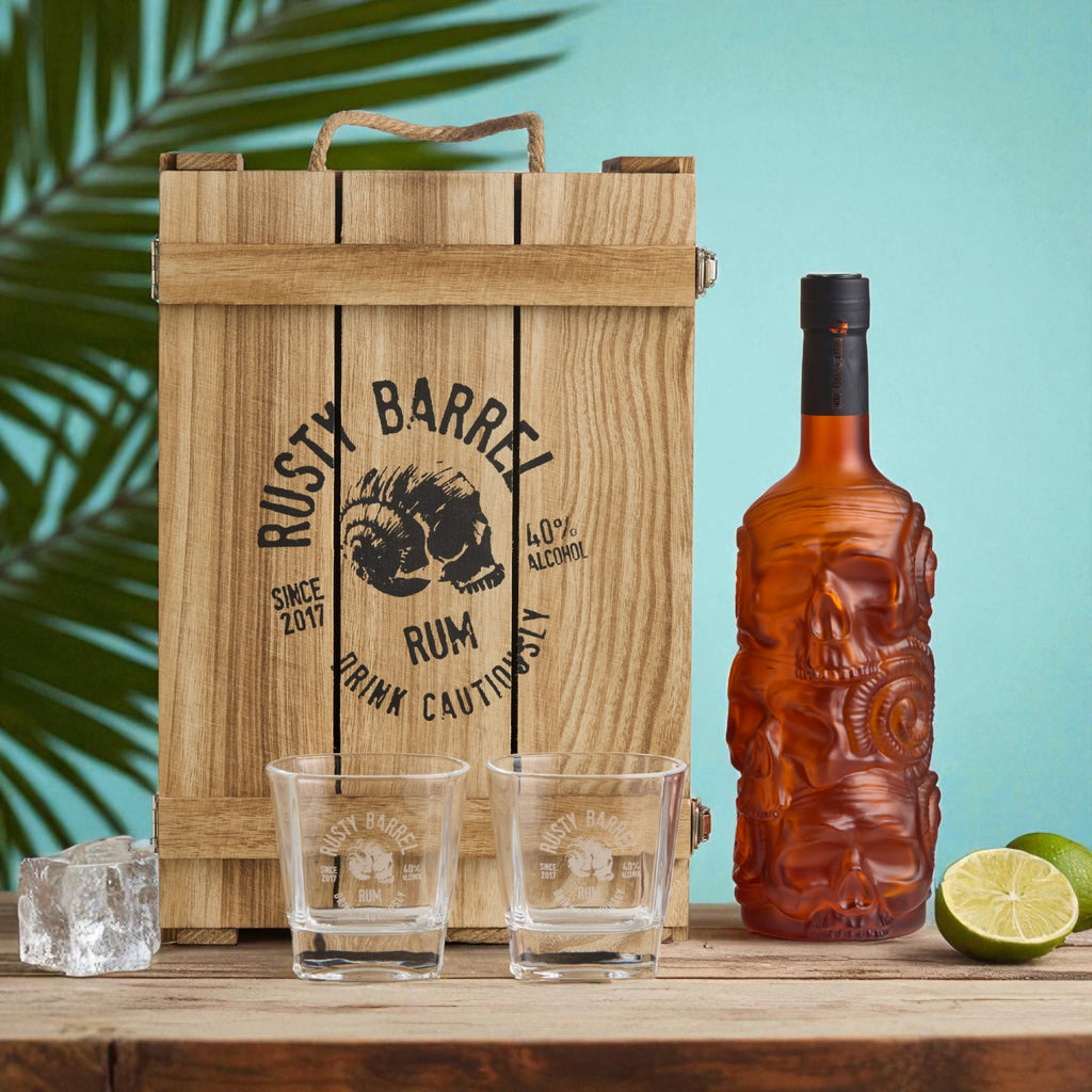 Rusty Barrel Rum bottle and packaging on a wooden surface with a blue background