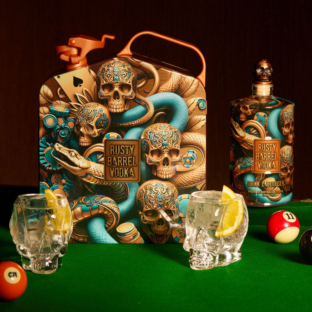 Rusty Barrel Vodka bottle and packaging with decorative skull design on a pool table.