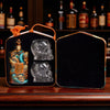 Rusty Barrel Vodka bottle and skull-shaped glass in a carrying case with a dark background.
