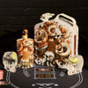 Rusty Barrel Vodka bottle and packaging with skull-themed glasses and playing cards on a black background