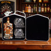 Rusty Barrel Vodka bottle with skull-shaped glass in a black carrying case on a wooden surface.