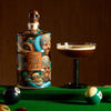 Rusty Barrel Vodka bottle with a cocktail on a pool table