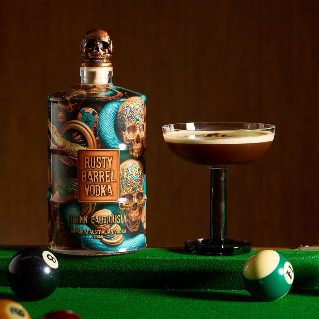Rusty Barrel Vodka bottle with a cocktail on a pool table