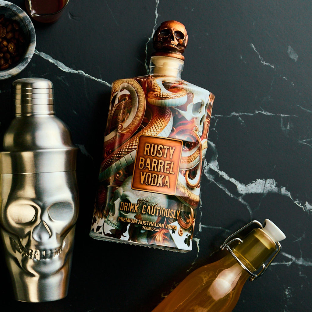 Bottle of Rusty Barrel Vodka with a skull-themed bottle cap on a dark surface.