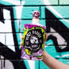 Rusty Barrel Vodka 700ml bottle held in front of a graffiti-covered wall