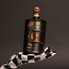 Bottle of Rusty Barrel Vodka 700ml Matte Black with a skull design against a dark background
