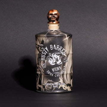 Bottle of Rusty Barrel Vodka 700ml Tattoo Deadmind with a skull design on a dark background