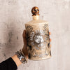 Bottle of Rusty Barrel Vodka 700ml Tattoo Series ThatGuy held by a hand against a textured gray background