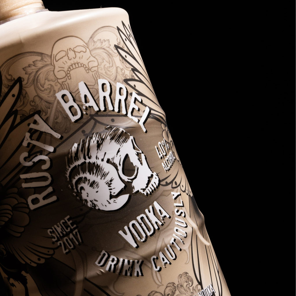 Rusty Barrel Vodka 700ml Tattoo Series That Guy bottle with intricate designs and text on a black background