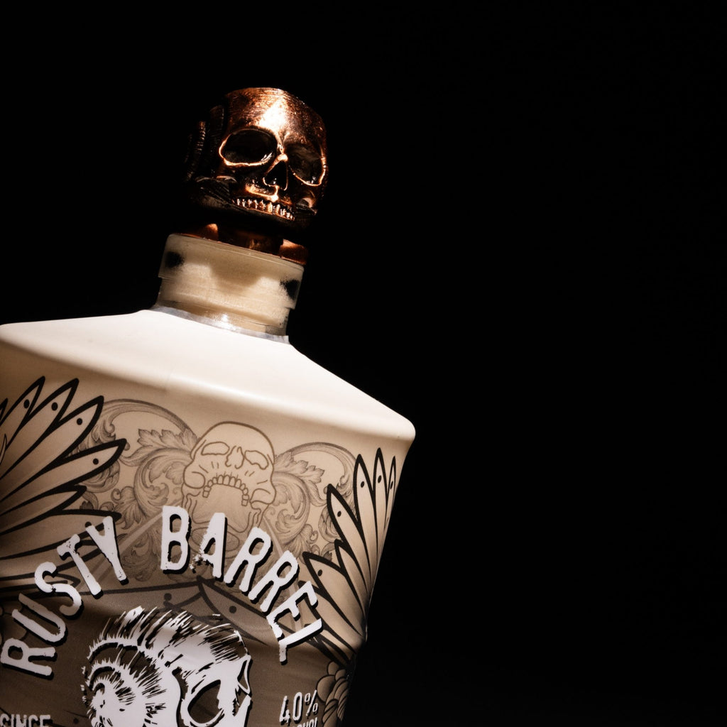 Bottle of Rusty Barrel Vodka 700ml Tattoo Series ThatGuy with copper skull stopper on a black background