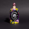 Colorful bottle of Rusty Barrel Vodka 700ml Yellow Wildstyle with a skull design on a dark background